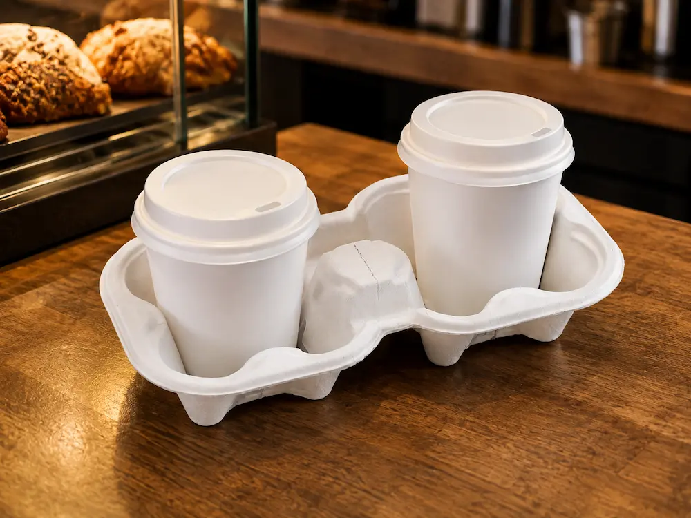 White tearable 2-cup molded pulp drink carrier used for takeaway coffee cups