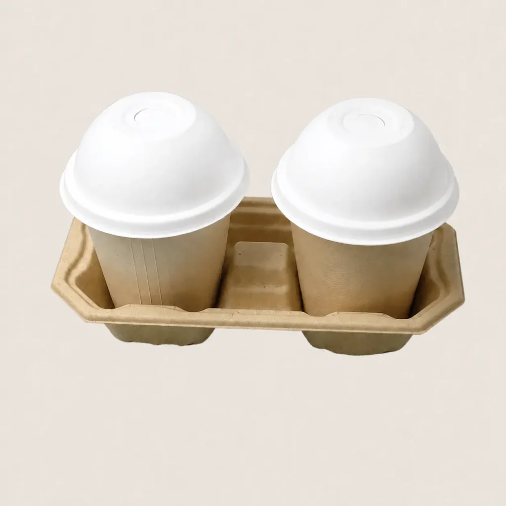 Two 90mm molded fiber cold cup dome lids fitted on takeaway cups in a molded fiber drink carrier
