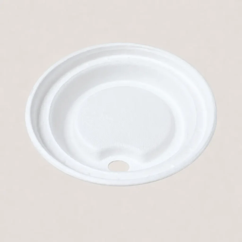Underside view of a white 90mm molded fiber hot cup sip lid showing its inner texture and molded cup-rim channel