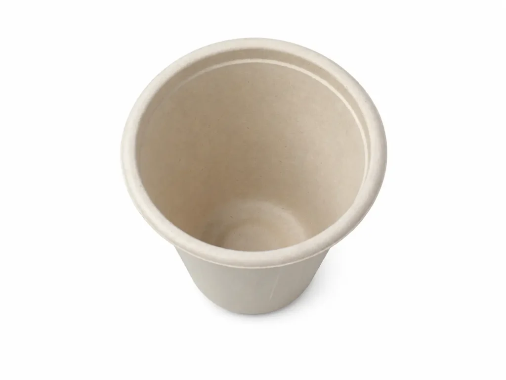 Top view of a natural-color 6.5oz Molded Fiber Cup showing its round opening, flanged rim, smooth inner surface, and tapered body