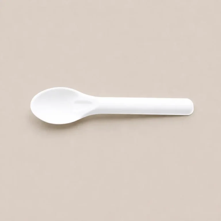 Horizontal top view of a white 6-Inch Wide-Bowl Molded Fiber Spoon with a broad oval bowl, reinforced neck, straight handle, and rounded end